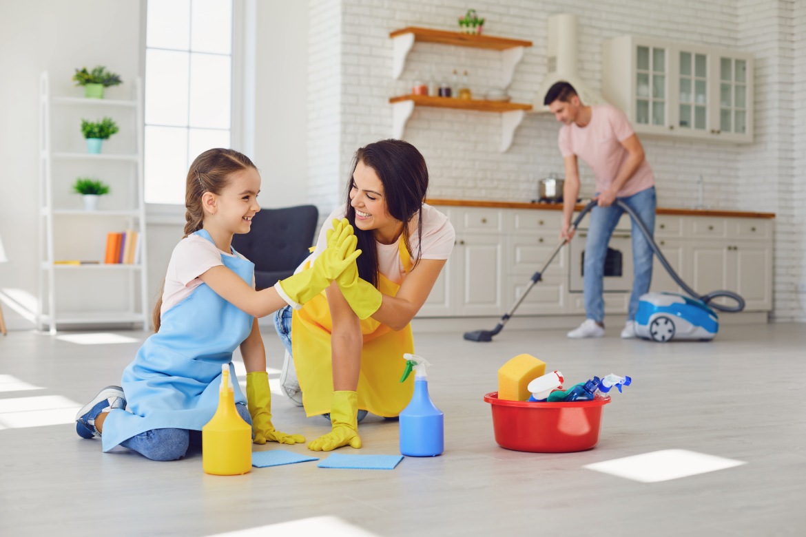 Happy family cleans the room in the house