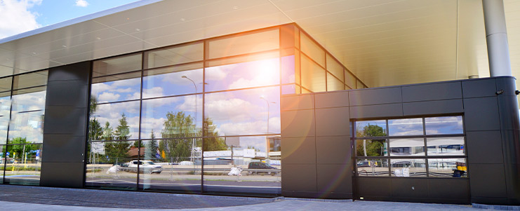 A modern commercial building in Texas with large windows, basking in sunlight, designed for growing businesses.