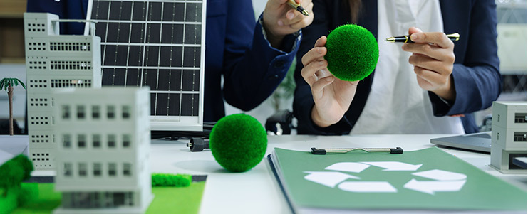 A man and woman collaborate on a project, using green balls, in a commercial construction setting in Texas.